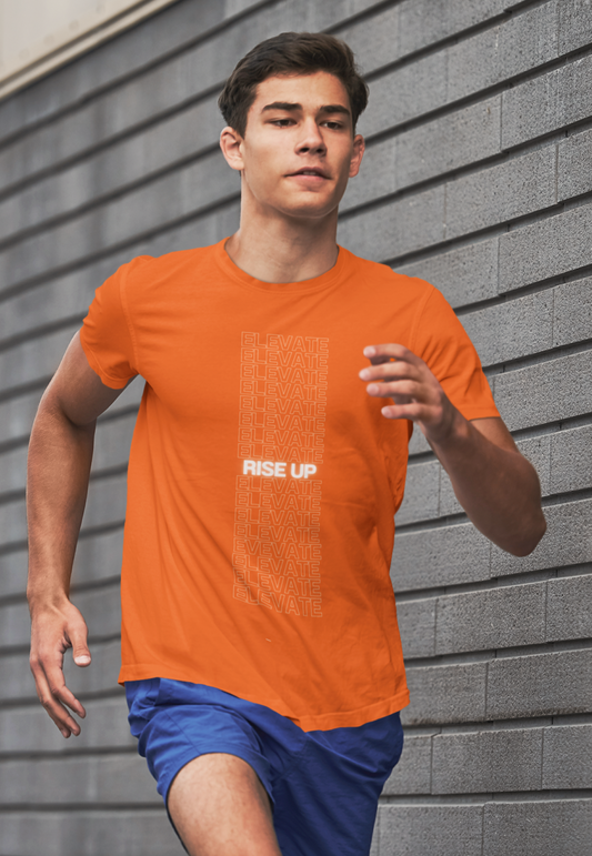 Person wearing an orange t-shirt with 'Rise Up' text against a gray wall