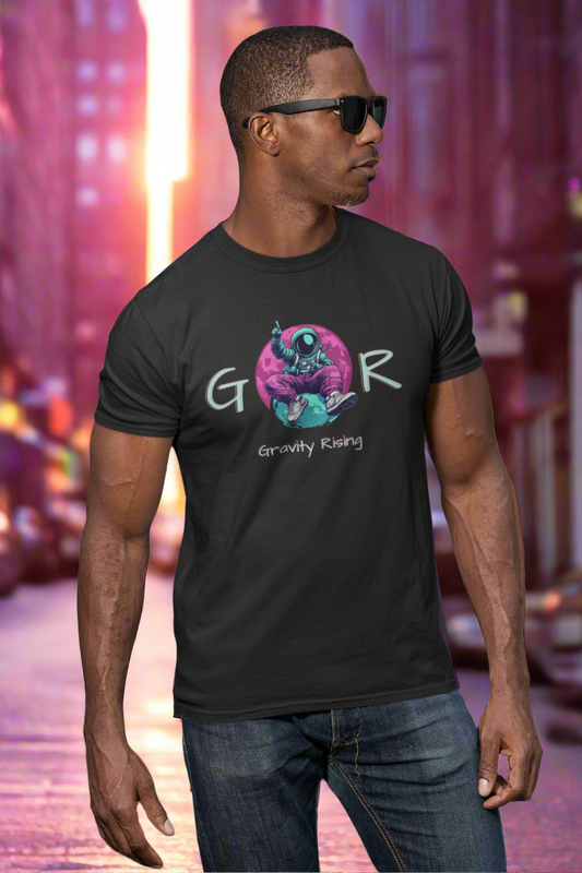 Man wearing a black t-shirt with a graphic design and text, standing in a colorful urban setting.